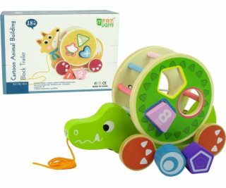 Zelený krokodýl pro tažení na kola třídič dřevěných bloků